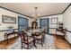 Spacious dining room with a chandelier, seating for six, and natural light at 612 W Chisholm St, Sanford, NC 27330