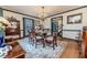Formal dining room with hardwood floors, elegant chandelier, and classic furnishings at 612 W Chisholm St, Sanford, NC 27330