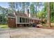 Home exterior with a screened-in porch and a large backyard and patio space at 612 W Chisholm St, Sanford, NC 27330