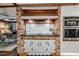 Kitchen showcasing brick oven area, stainless appliances, and open floor plan at 612 W Chisholm St, Sanford, NC 27330