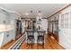 Kitchen features stone countertops, stainless appliances, island and wood floors at 612 W Chisholm St, Sanford, NC 27330