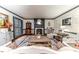 Cozy living room with a fireplace, hardwood floors and elegant decor perfect for relaxing and entertaining at 612 W Chisholm St, Sanford, NC 27330