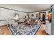 Spacious living room with hardwood floors, a large area rug, and classic furniture at 612 W Chisholm St, Sanford, NC 27330