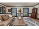 Spacious living room with hardwood floors, large windows, and comfortable seating at 612 W Chisholm St, Sanford, NC 27330
