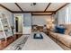 Comfortable living room features hardwood floors, exposed beams, and cozy seating at 612 W Chisholm St, Sanford, NC 27330
