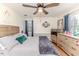 Main bedroom with hardwood floors, a ceiling fan, and a serene, inviting atmosphere at 612 W Chisholm St, Sanford, NC 27330