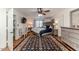 Spacious main bedroom features a ceiling fan, sitting area, and view to the main bed at 612 W Chisholm St, Sanford, NC 27330