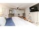 Spacious main bedroom features a ceiling fan, sitting area, and multiple closets at 612 W Chisholm St, Sanford, NC 27330