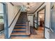 Classic wooden staircase with dark accents, leading to the upper level and adjacent rooms at 612 W Chisholm St, Sanford, NC 27330