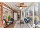 Bright and airy sunroom with brick accents, ceiling fan, tile flooring, and lots of natural light at 612 W Chisholm St, Sanford, NC 27330