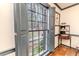 This cozy room has a large window with shutters, providing natural light and a view of the outdoors at 612 W Chisholm St, Sanford, NC 27330