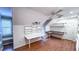 Bonus room offers hardwood floors, built-in shelves, and a desk space for optimal productivity at 6317 Lakeland Dr, Raleigh, NC 27612