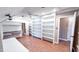Spacious bonus room with built-in shelves, desk and hardwood floors is perfect for hobbies at 6317 Lakeland Dr, Raleigh, NC 27612