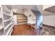 Bonus room with built-in shelves, desk and hardwood floors provides ample storage and workspace at 6317 Lakeland Dr, Raleigh, NC 27612