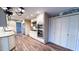 Well-lit kitchen boasts white cabinetry, stainless steel appliances, a practical layout, and ample storage space at 6317 Lakeland Dr, Raleigh, NC 27612