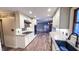 Bright kitchen with white cabinets, stainless steel appliances, granite countertops, and wood-look flooring for modern charm at 6317 Lakeland Dr, Raleigh, NC 27612