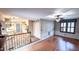 Open-concept living room and kitchen area with wood floors and ceiling fan at 6317 Lakeland Dr, Raleigh, NC 27612