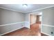 Inviting living room features a pass-through to another living area with a window at 6317 Lakeland Dr, Raleigh, NC 27612
