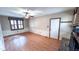 Well-lit living room features wood floors, a brick fireplace, and a window at 6317 Lakeland Dr, Raleigh, NC 27612