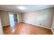 This living room features a doorway to the sunroom and neutral colored walls at 6317 Lakeland Dr, Raleigh, NC 27612