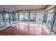 Bright sunroom with large windows and wood floors, perfect for relaxing at 6317 Lakeland Dr, Raleigh, NC 27612
