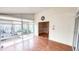 Bright sunroom offers wood floors, backyard views, and access to another room at 6317 Lakeland Dr, Raleigh, NC 27612