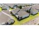 An aerial view of a neighborhood showcasing a home with a patio, screened porch and landscaping at 65 Balsam Ln, Clayton, NC 27527