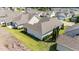 Aerial view showcases a lovely home with patio, screened porch, and manicured landscaping at 65 Balsam Ln, Clayton, NC 27527