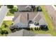 Aerial view of a lovely home with an outdoor patio, screened porch, and landscaped yard at 65 Balsam Ln, Clayton, NC 27527
