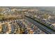 An aerial view of a community featuring tree lined streets and neighborhood homes at 65 Balsam Ln, Clayton, NC 27527