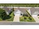 Aerial shot of a beautiful home showcasing a well-kept lawn and a two-car garage at 65 Balsam Ln, Clayton, NC 27527