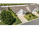 Charming home aerial view featuring a well-manicured lawn and inviting two-car garage at 65 Balsam Ln, Clayton, NC 27527