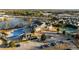 Aerial view of clubhouse, pool, parking and surrounding neighborhood near a pond at 65 Balsam Ln, Clayton, NC 27527