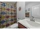 Traditional bathroom featuring a sink, toilet, and shower with a curtain at 65 Balsam Ln, Clayton, NC 27527