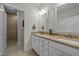 Bright bathroom with double sinks, granite countertops, and a tiled walk-in shower at 65 Balsam Ln, Clayton, NC 27527