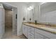 Bathroom featuring double sink vanity, granite countertops, and tile floor at 65 Balsam Ln, Clayton, NC 27527