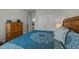 Bedroom with a decorative comforter and view of a door with an oven in the background at 65 Balsam Ln, Clayton, NC 27527