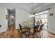 Elegant dining room with sliding glass door and stylish chandelier at 65 Balsam Ln, Clayton, NC 27527