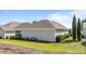 View of the home's exterior with an inviting screened porch and beautiful landscaping at 65 Balsam Ln, Clayton, NC 27527