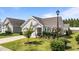 Beautiful single-Gathering home featuring lush landscaping, a well-maintained lawn, and a cozy front porch at 65 Balsam Ln, Clayton, NC 27527