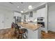 Open kitchen featuring granite island with barstool seating, stainless appliances, and white cabinets at 65 Balsam Ln, Clayton, NC 27527