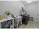 Convenient laundry room with utility sink, countertop space, washer, and dryer at 65 Balsam Ln, Clayton, NC 27527