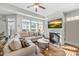 Cozy living room featuring a fireplace and lots of natural light at 65 Balsam Ln, Clayton, NC 27527