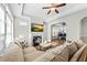 Bright living room with fireplace, hardwood floors and lots of sunlight at 65 Balsam Ln, Clayton, NC 27527