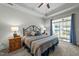 Comfortable bedroom featuring a decorative bed frame and sliding glass door leading to a patio at 65 Balsam Ln, Clayton, NC 27527