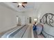 Cozy bedroom featuring decorative pillows, carpet, and a ceiling fan at 65 Balsam Ln, Clayton, NC 27527