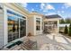 Outdoor patio with multiple sliding glass doors and seating areas at 65 Balsam Ln, Clayton, NC 27527