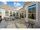 Outdoor patio area with seating and multiple large windows at 65 Balsam Ln, Clayton, NC 27527
