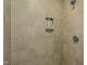 Walk-in shower featuring neutral colored tile and built-in shelving at 65 Balsam Ln, Clayton, NC 27527
