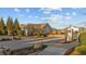 Street view of a neighborhood entrance, with an iron gate, lush landscaping and signage at 65 Balsam Ln, Clayton, NC 27527